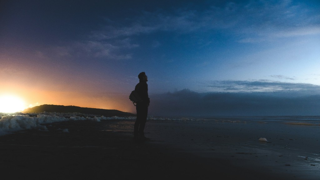 Matt Bennett on a beach at sunset